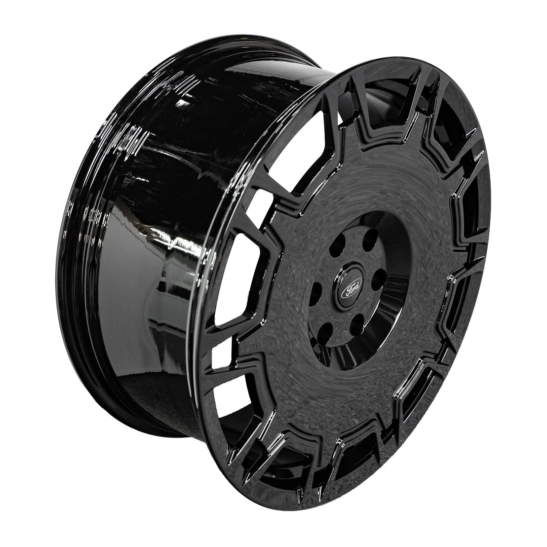 A glossy black multi-spoke alloy wheel rim shown at a three-quarter angle on a plain white background.