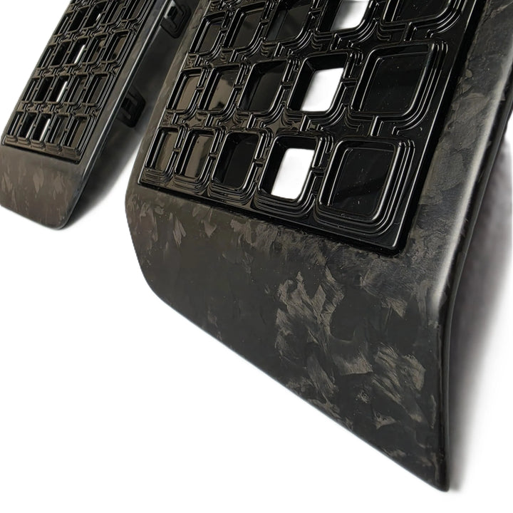 Close-up of a black and dark gray Forged carbon-fiber Side Vent Grille with a raised grid texture, shown on a white background.


