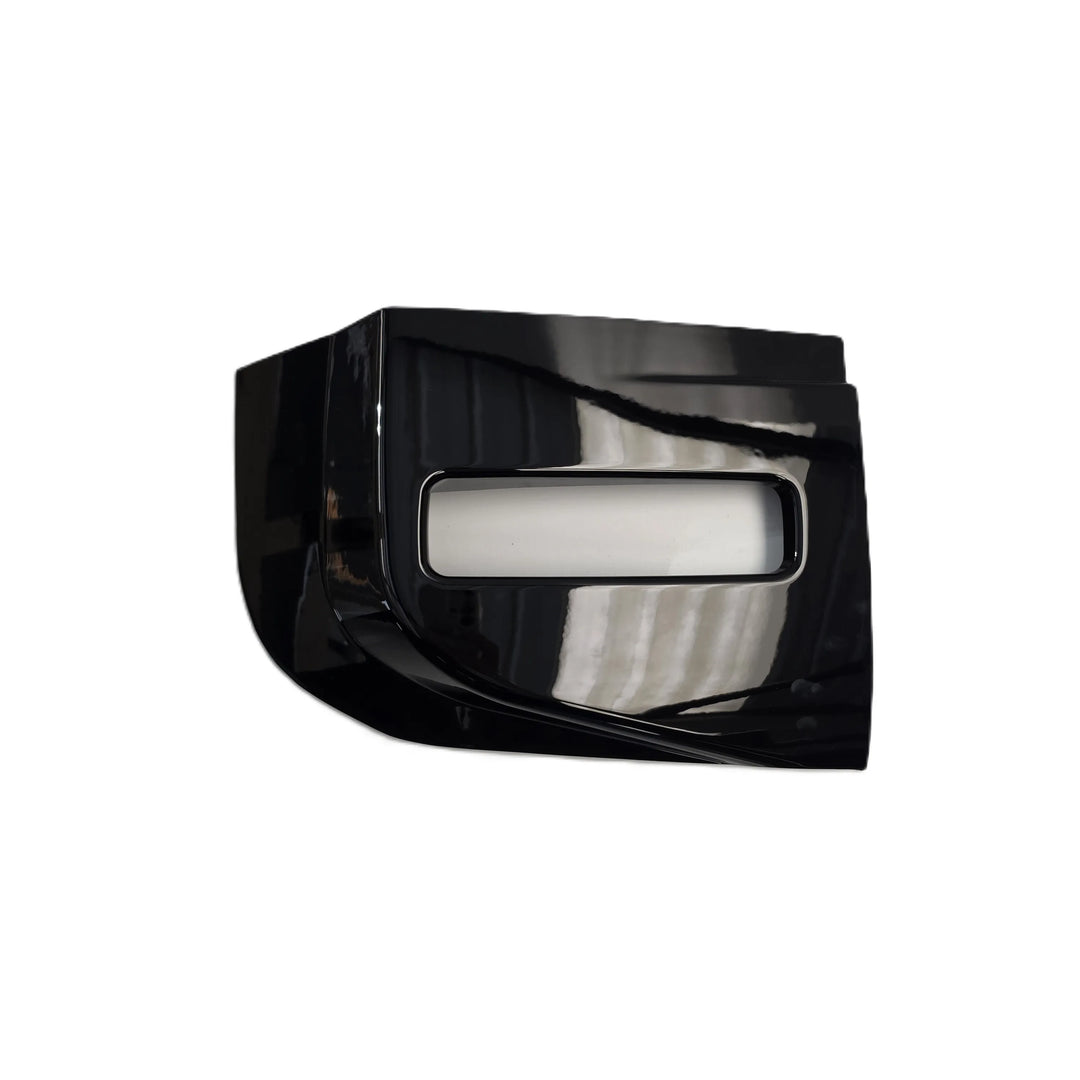 A glossy black plastic automotive part with a rectangular cutout, single, one fog light surround shown on a plain white background.