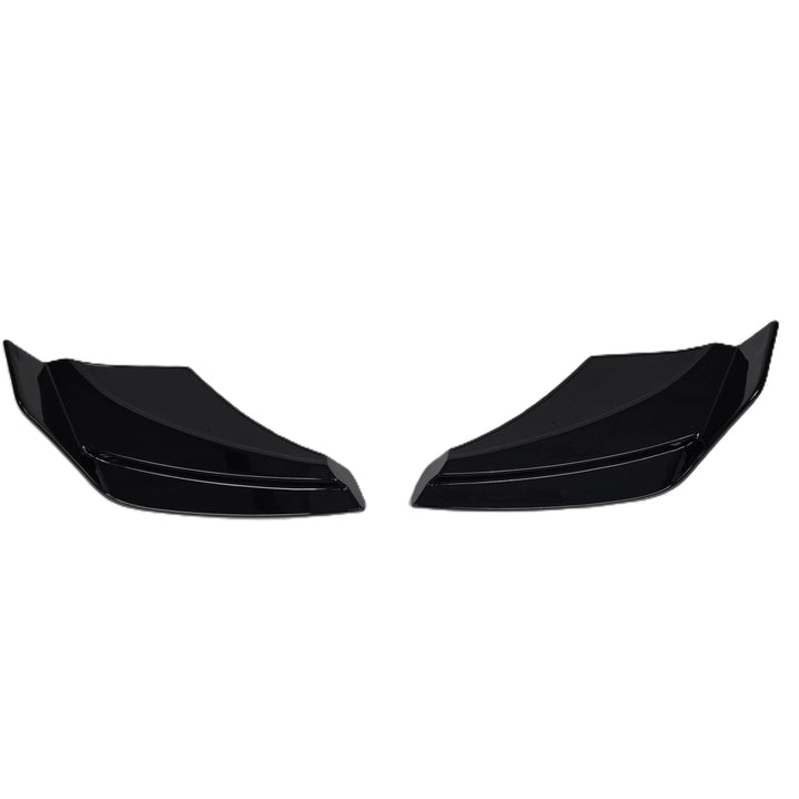 A pair of glossy black plastic car body trim pieces, Rear Bumper splitter or Trim extensions, shown against a plain white background.

