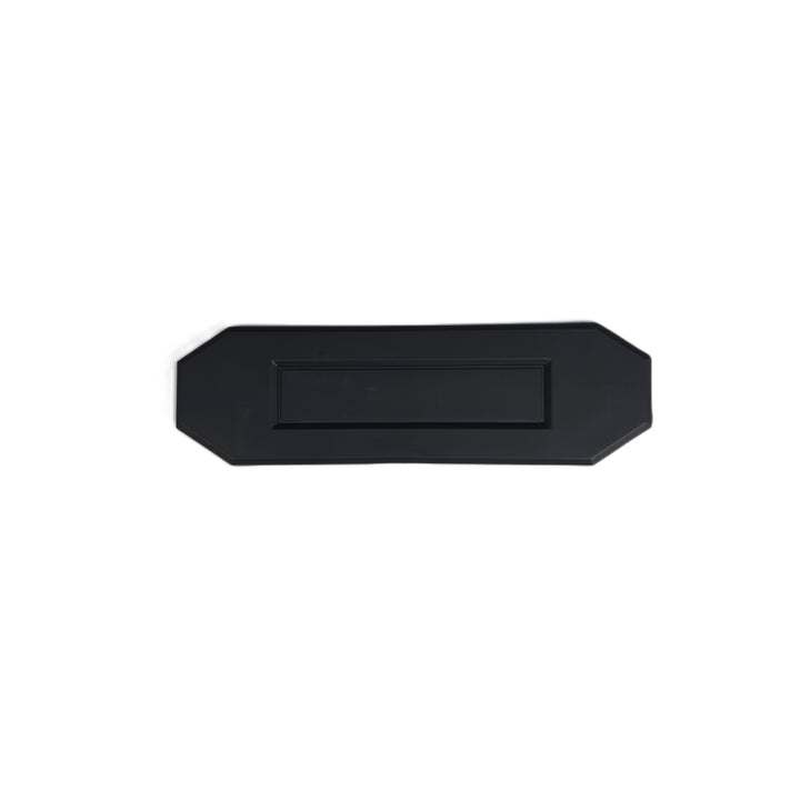 A black 'O' lettering a recessed center panel and beveled edges is a missing O letter for a ford ranger tailgate cover , shown on a plain white background.

