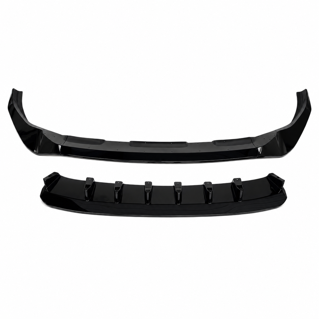 A pair of glossy black automotive bumper lip trim pieces, one showing the outer front face and the other showing the inner mounting recesses, set against a plain white background.