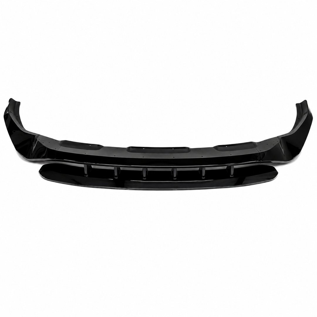 A black plastic car front splitter bumper lip trim piece, shown horizontally full built up kit against a plain white background.