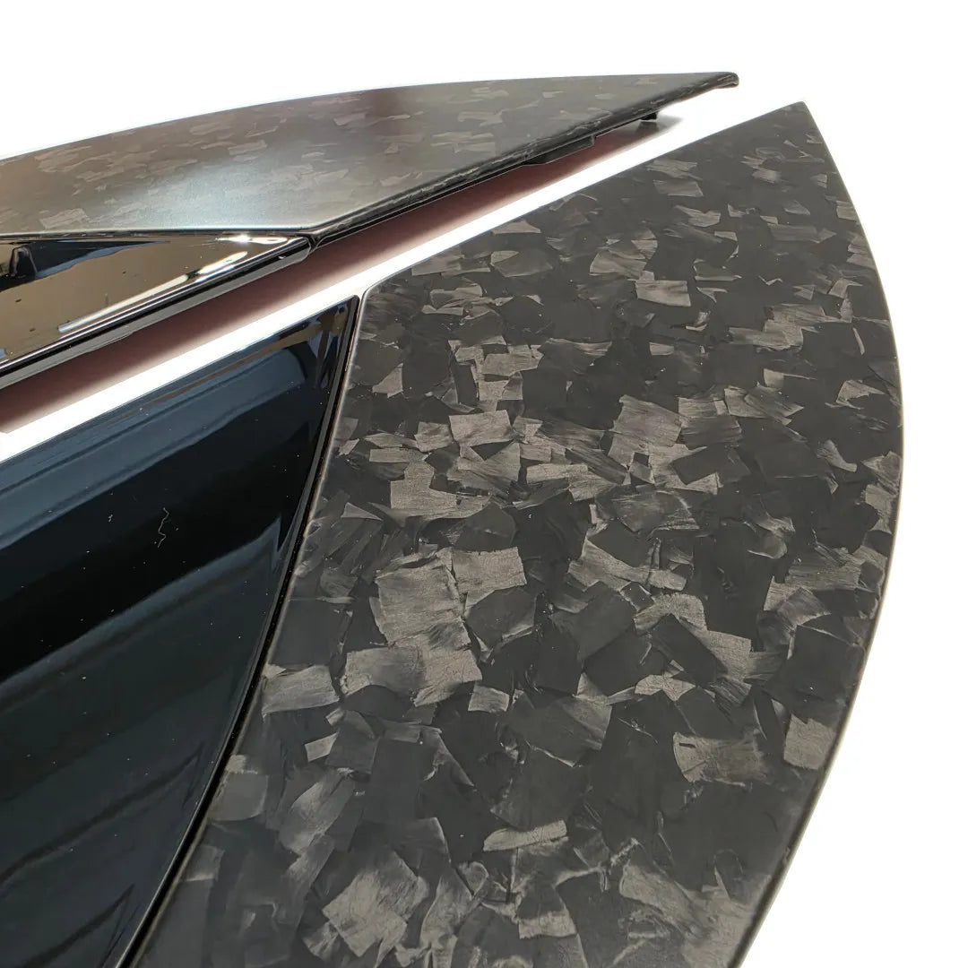 end close up shot of a Pair of Forged Carbon Fibre and Gloss Black Bonnet vents Pair on a pure white background