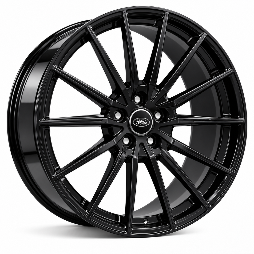 A glossy black multi-spoke alloy car wheel rim with a central Land Rover badge, shown on a clean white background.