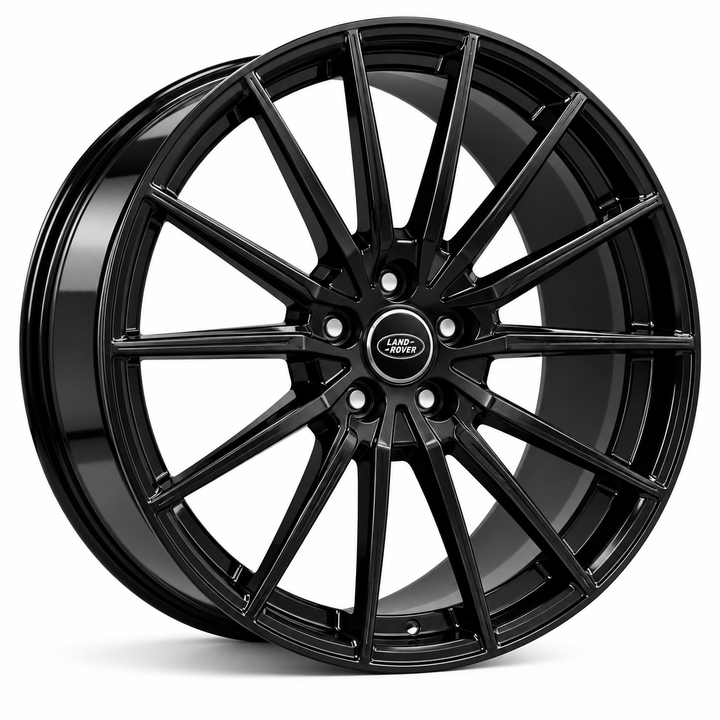 A glossy black multi-spoke alloy car wheel rim with a central Land Rover badge, shown on a clean white background.