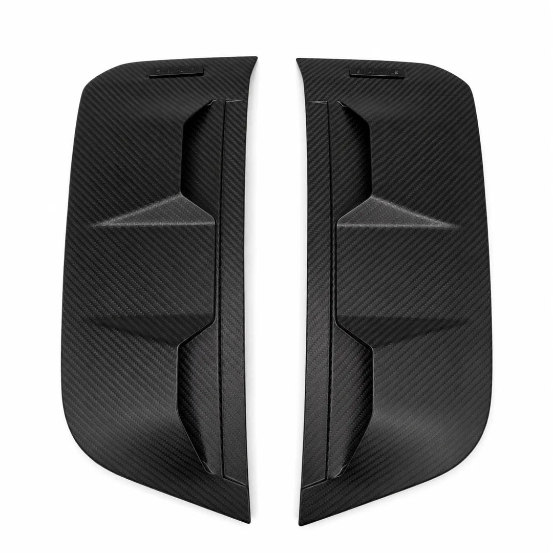 A pair of black Dry carbon fiber side mirror covers with a textured woven pattern, displayed on a solid white background.