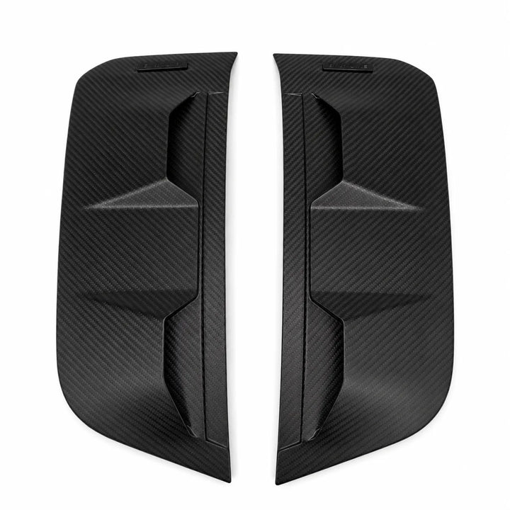 A pair of black Dry carbon fiber side mirror covers with a textured woven pattern, displayed on a solid white background.