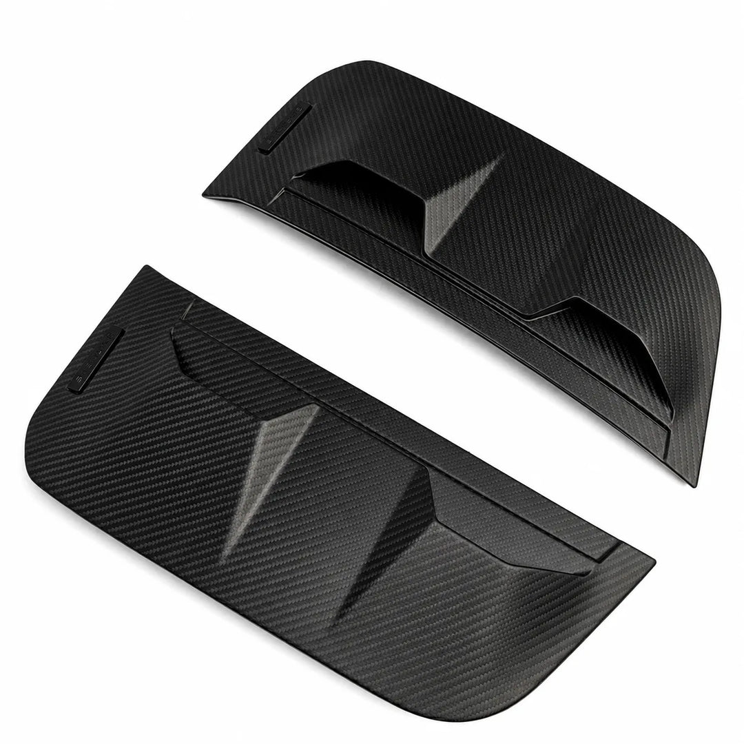 A pair of black carbon fiber textured side Dry Carbon Vent covers, displayed on a clean white background.