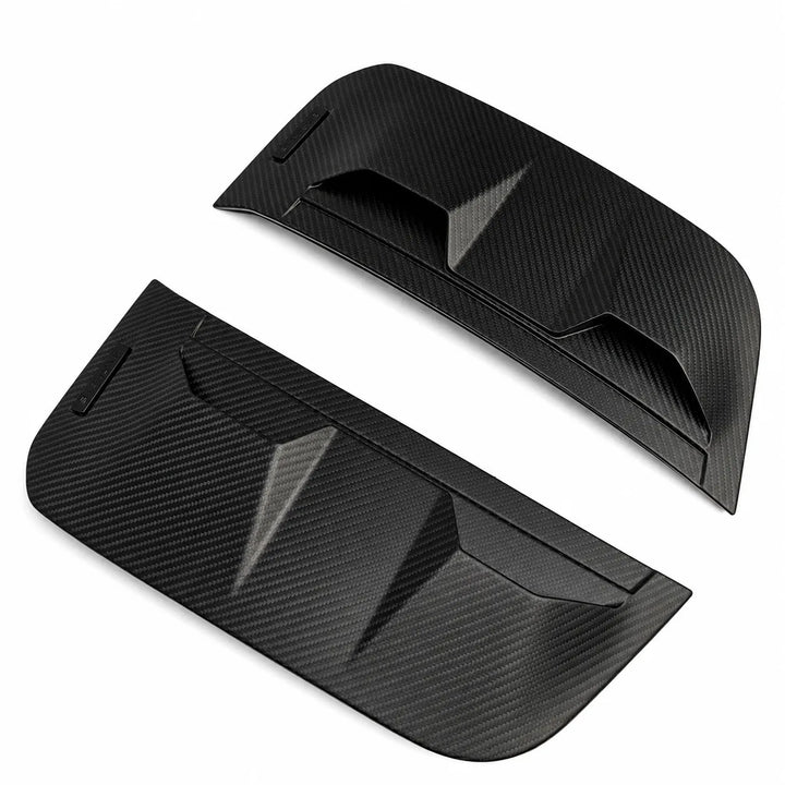 A pair of black carbon fiber textured side Dry Carbon Vent covers, displayed on a clean white background.