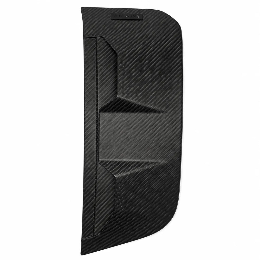 A black carbon fiber textured panel, likely an automotive side vent cover or trim piece, shown against a plain white background.