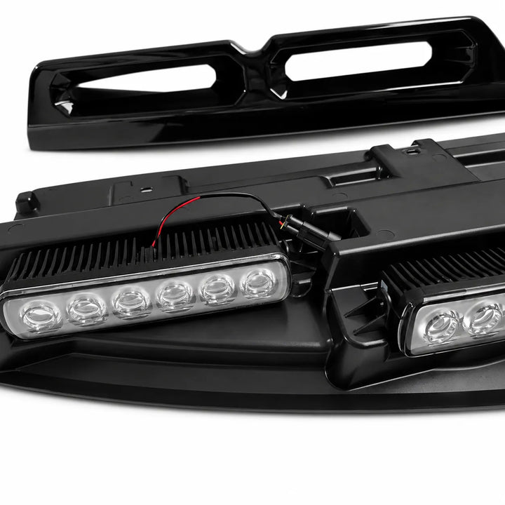 Black LED light bar kit for a vehicle, showing the main light bar assembly with wiring and a separate glossy black trim piece on a white background.