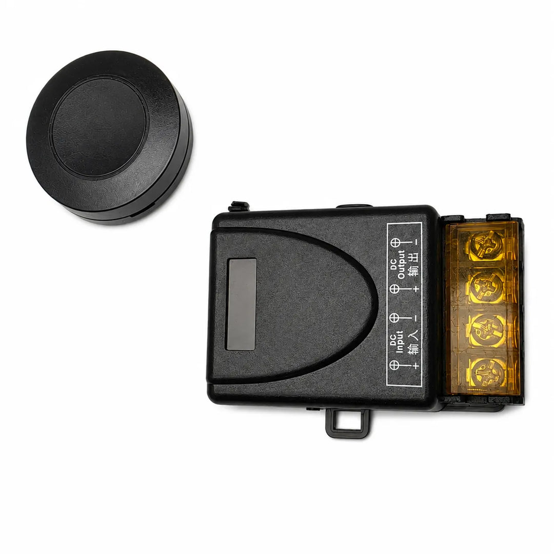 A black electronic control module and a round black cap shown separately on the left, photographed on a white background.