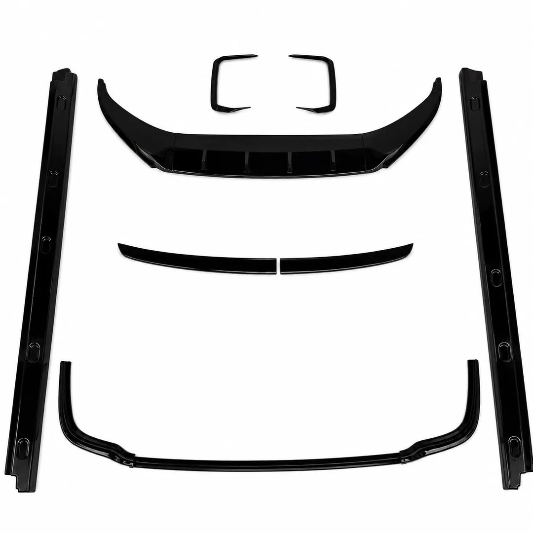 A set of glossy black automotive trim pieces, including a front lip spoiler, rear lip spoiler, trunk lid trim, and side moldings, arranged on a plain white background.