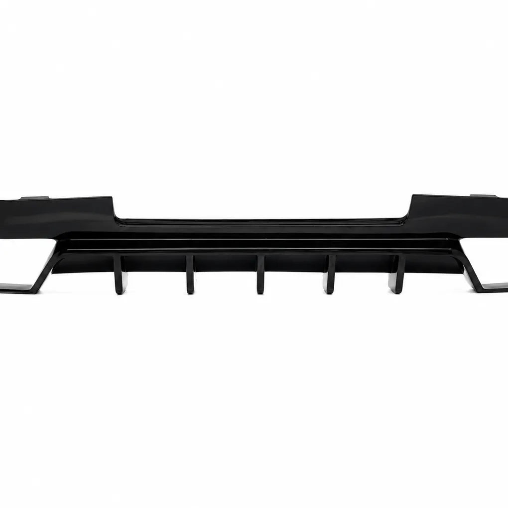 A black plastic automotive rear splitter or lower grille trim piece with vertical vent-like tabs, shown against a plain white background.