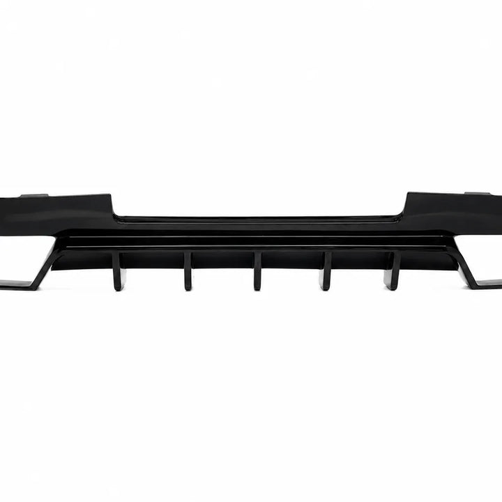A black plastic automotive rear splitter or lower grille trim piece with vertical vent-like tabs, shown against a plain white background.