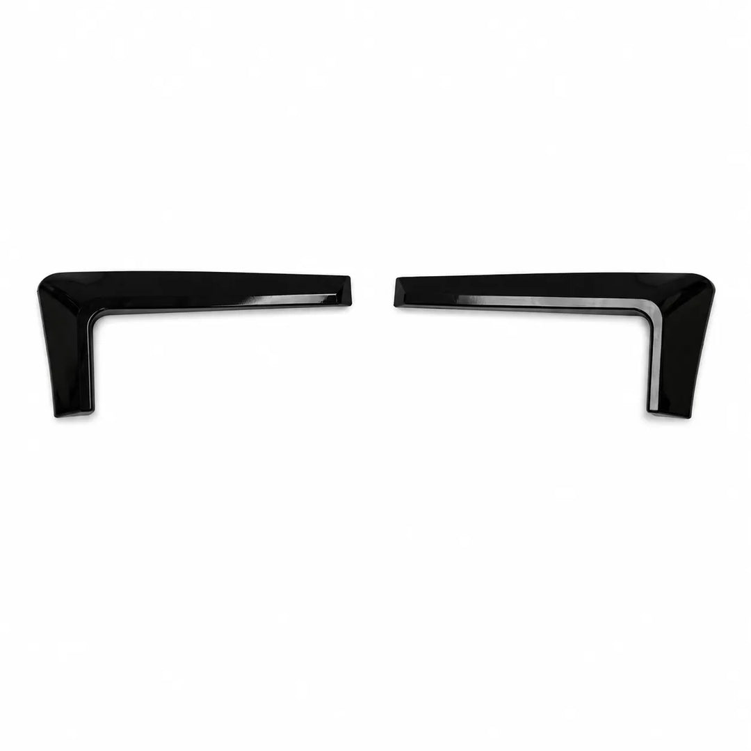 Two black car Headlight Eyebrow Fog Surrounds Pair with no Notches on a white background


