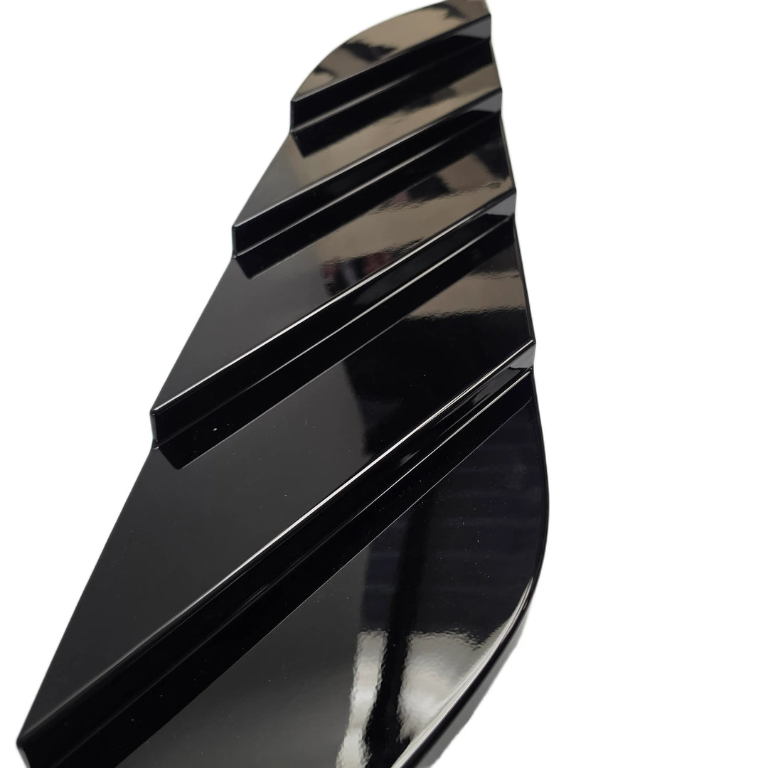 A glossy black curved accessory with a ribbed, segmented design, shown on a plain white background.