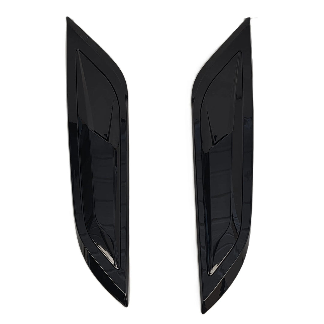 A pair of glossy black car bonnet vent covers, shown as a pair on a plain white background.