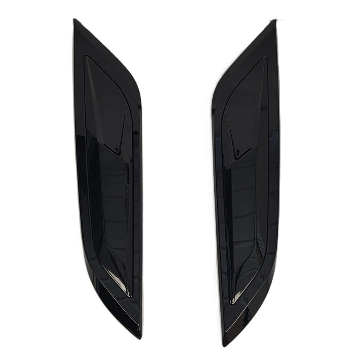 A pair of glossy black car bonnet vent covers, shown as a pair on a plain white background.