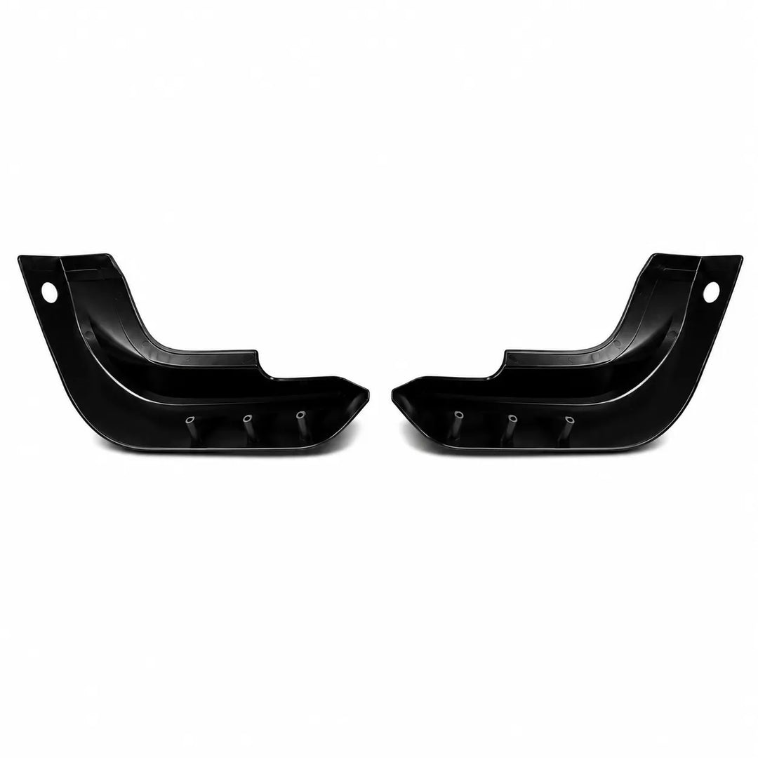 A pair of black plastic vehicle canards or arch protectors shown on a plain white background.