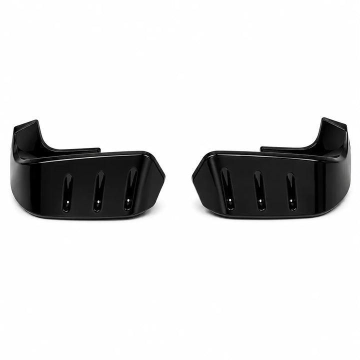 A pair of glossy black plastic handlebar grips with ventilation slots, shown on a plain white background.