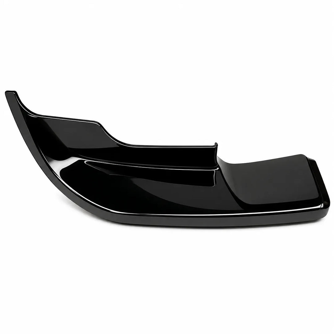 A single, glossy black plastic lower bumper trim piece, low lip fender extension, no parking sensors shown against a plain white background.