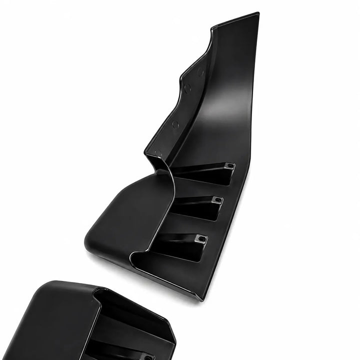Black lower bumper trim molded plastic automotive trim or panel piece shown on a plain white background, with a second matching piece partially visible at the bottom left.