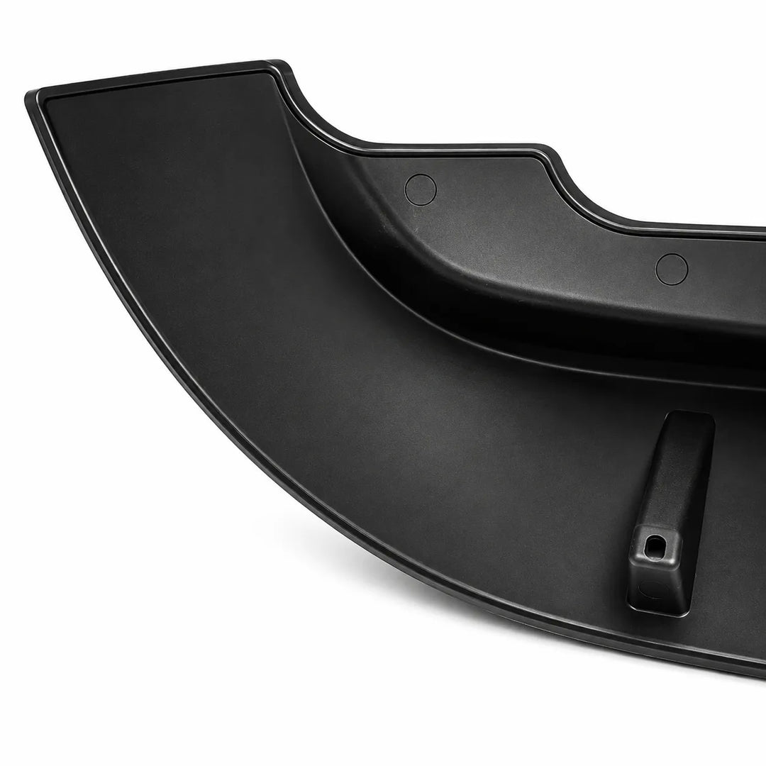 A curved black plastic automotive part, likely a bumper lip or trim piece, shown on a plain white background.