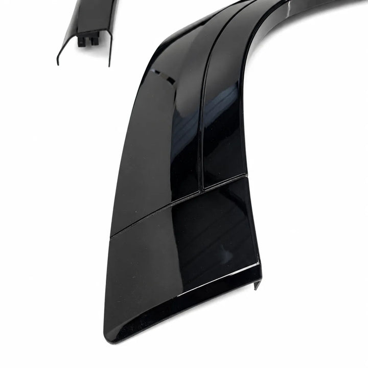 A glossy black automotive body trim piece or wheel arch wide flare fender section shown on a plain white background