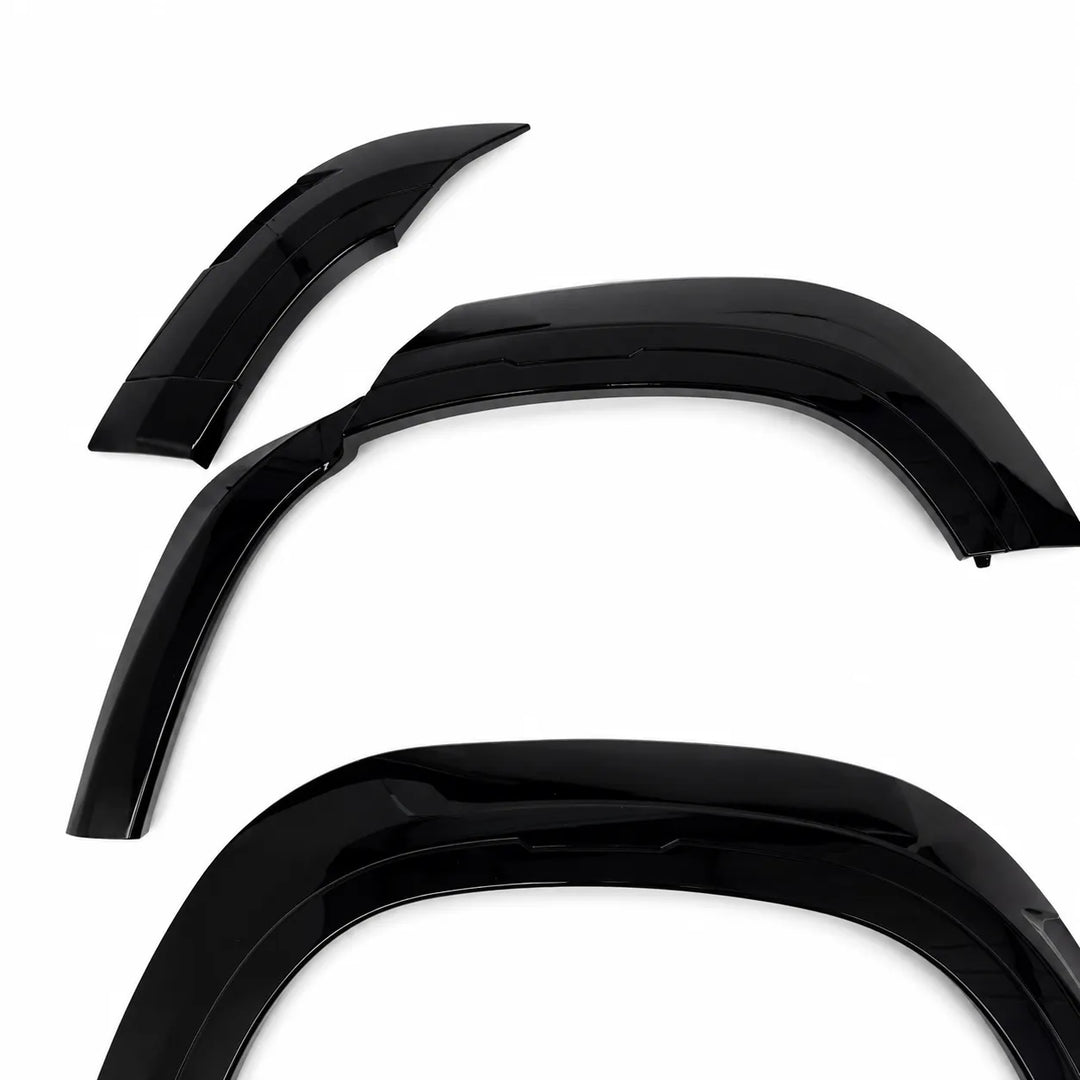 Three glossy black defender L663 Land Rover automotive Wide wheel Arch shown on a plain white background.