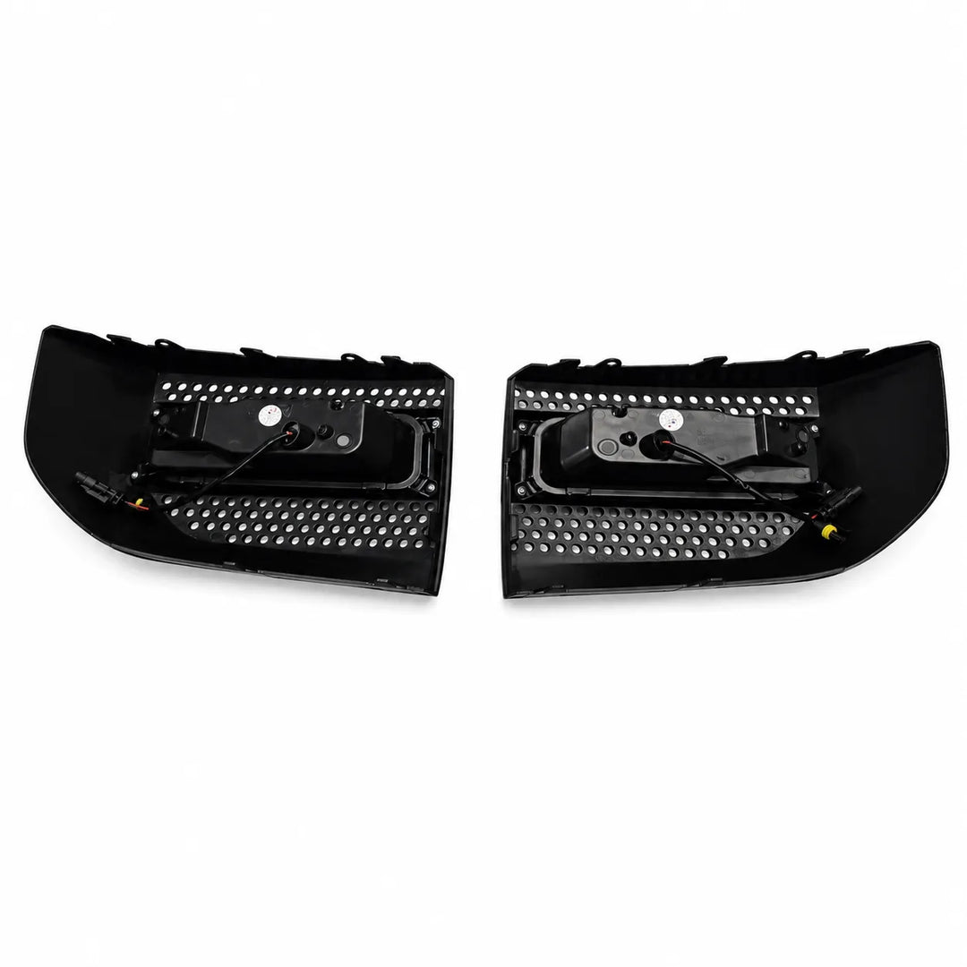 rear reverse shot of a black LED light bar with clear lens 4 LED lower fog lamp on a white background