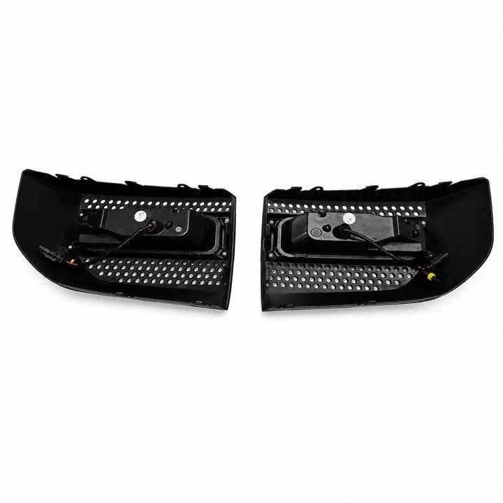 rear reverse shot of a black LED light bar with clear lens 4 LED lower fog lamp on a white background