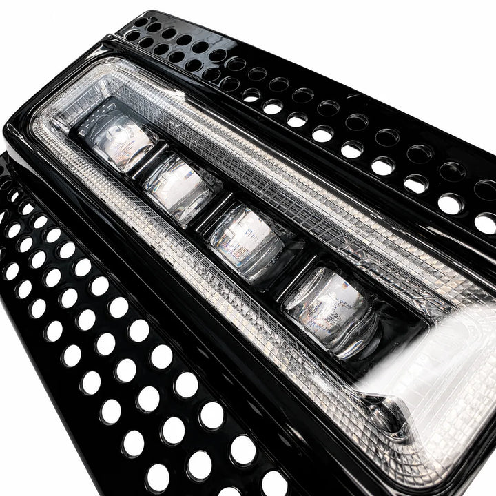 Close-up of a black LED light bar with clear lens 4 LED lower fog lamp on a white background
