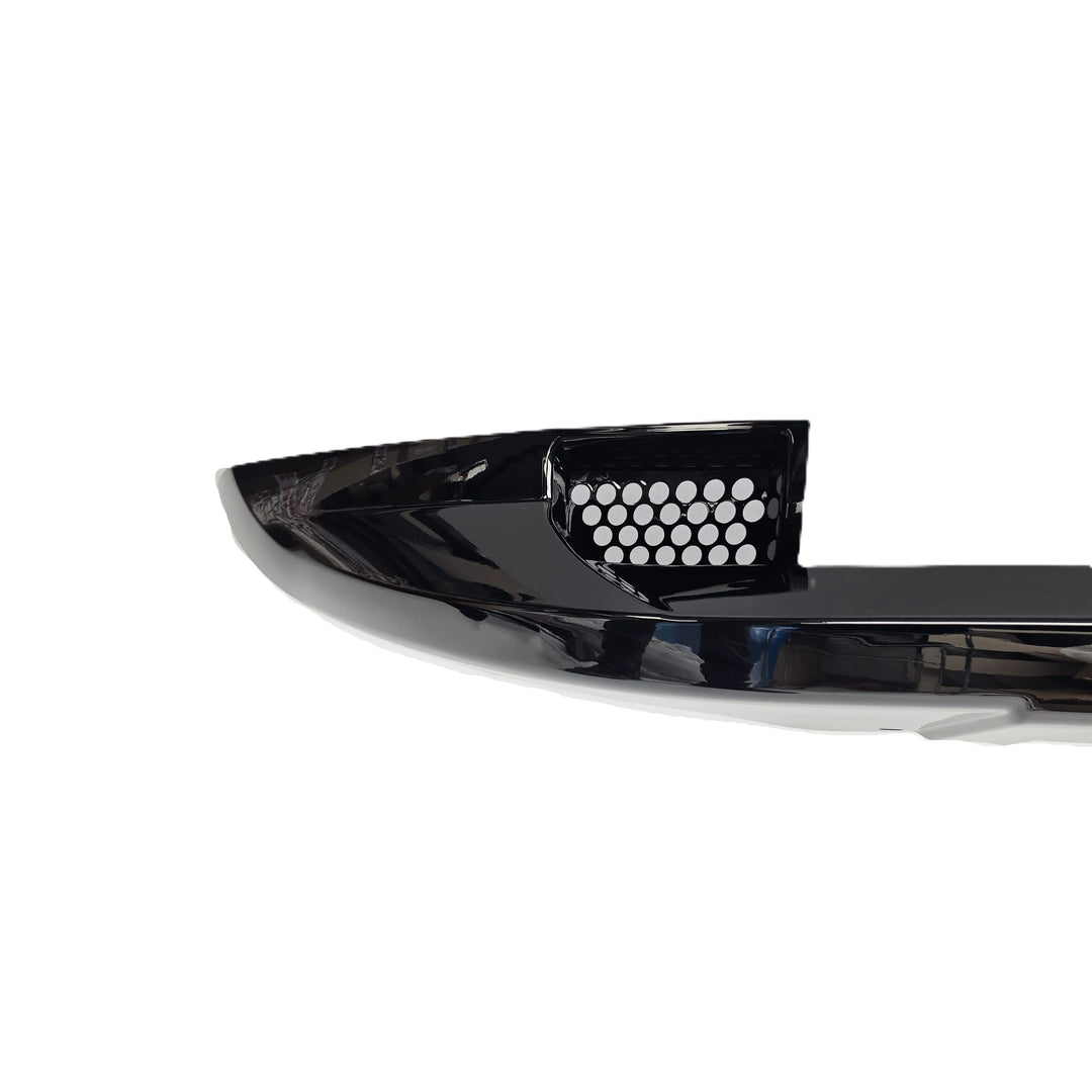 A glossy reflective black plastic automotive bumper Khan style Look lip kit honeycomb grill, displayed on a clean white background.
