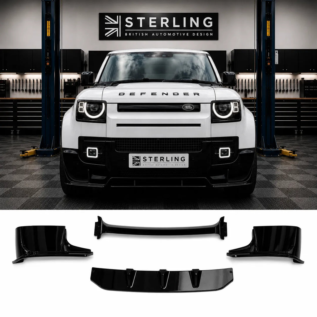 A white Defender SUV is shown in a garage setting with a black front lip spoiler kit displayed below on a white background. The kit is for a complete front bumper splitter