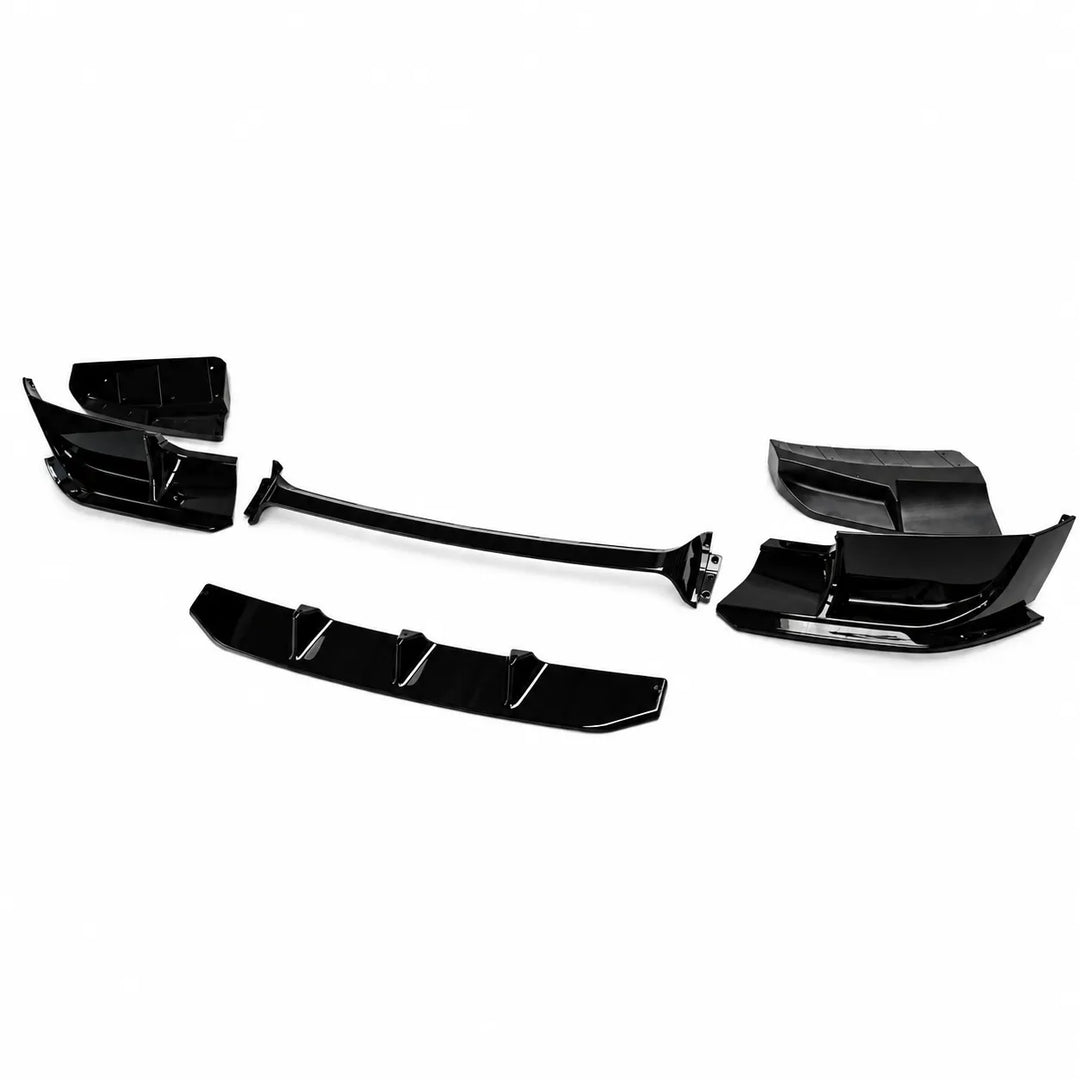 A set of glossy black automotive body trim pieces, including a long center bar and corner trim sections, displayed on a clean white background.
