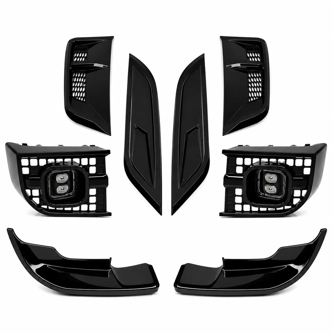 A set of glossy black car exterior trim pieces, including two large lower lip spoilers, two tall center bonnet smooith trim pieces, and two side grille inserts, arranged on a plain white background.