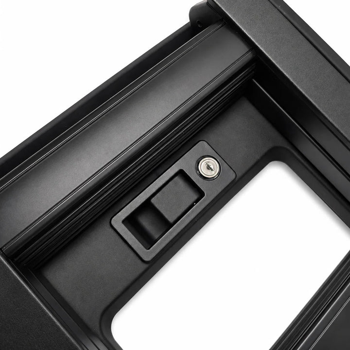 Close-up of a black metal foot rung ladder section with a latch mechanism and a small keyhole detail, shown on a white background.