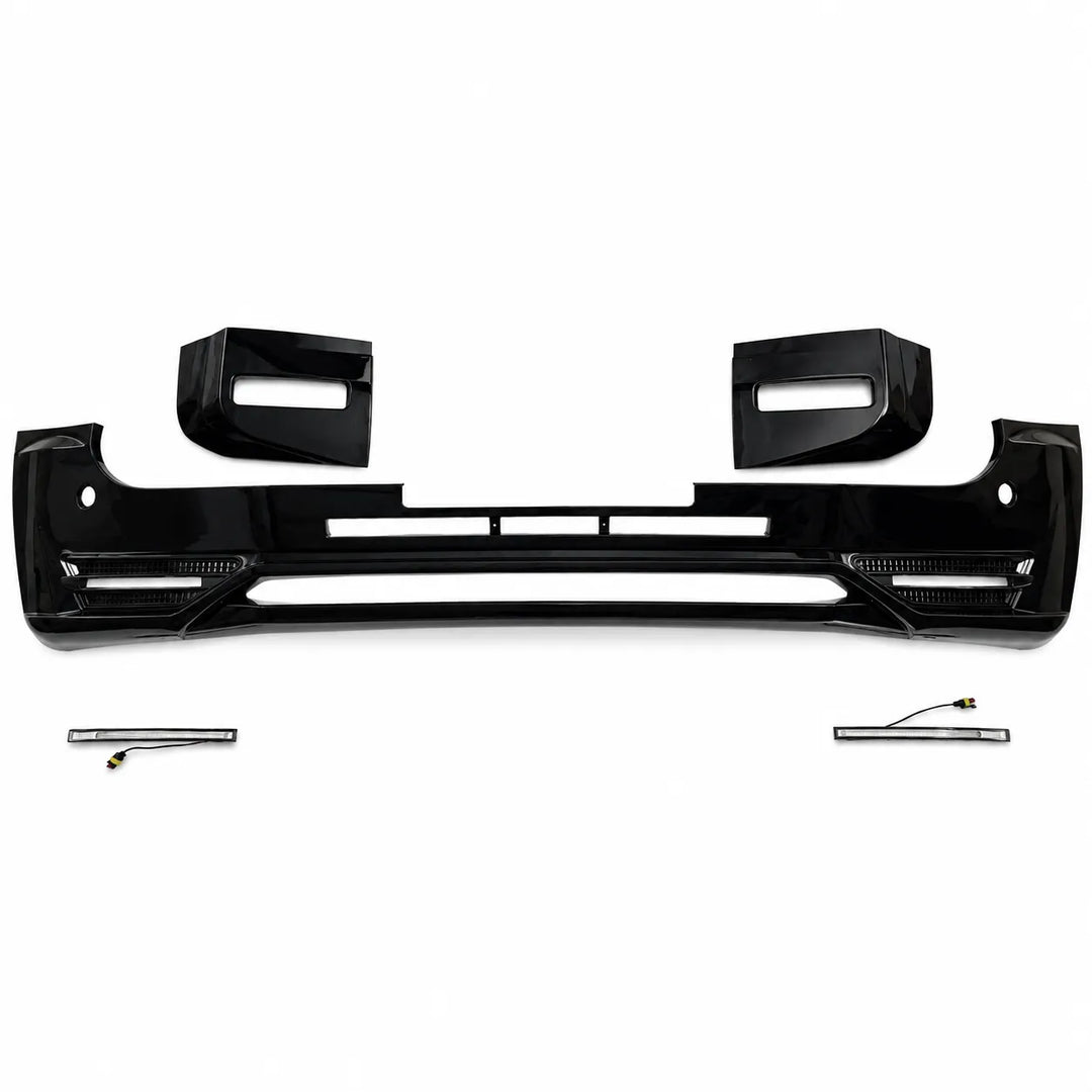 A black glossy front bumper lip kit with integrated fog light housings and two small fog light cover surrounds, displayed on a clean white background.