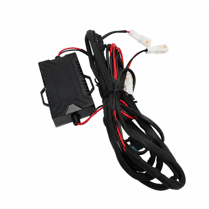 A black electronic control module with attached wiring harness, including red and black wires and white connector plugs, shown on a plain white background.