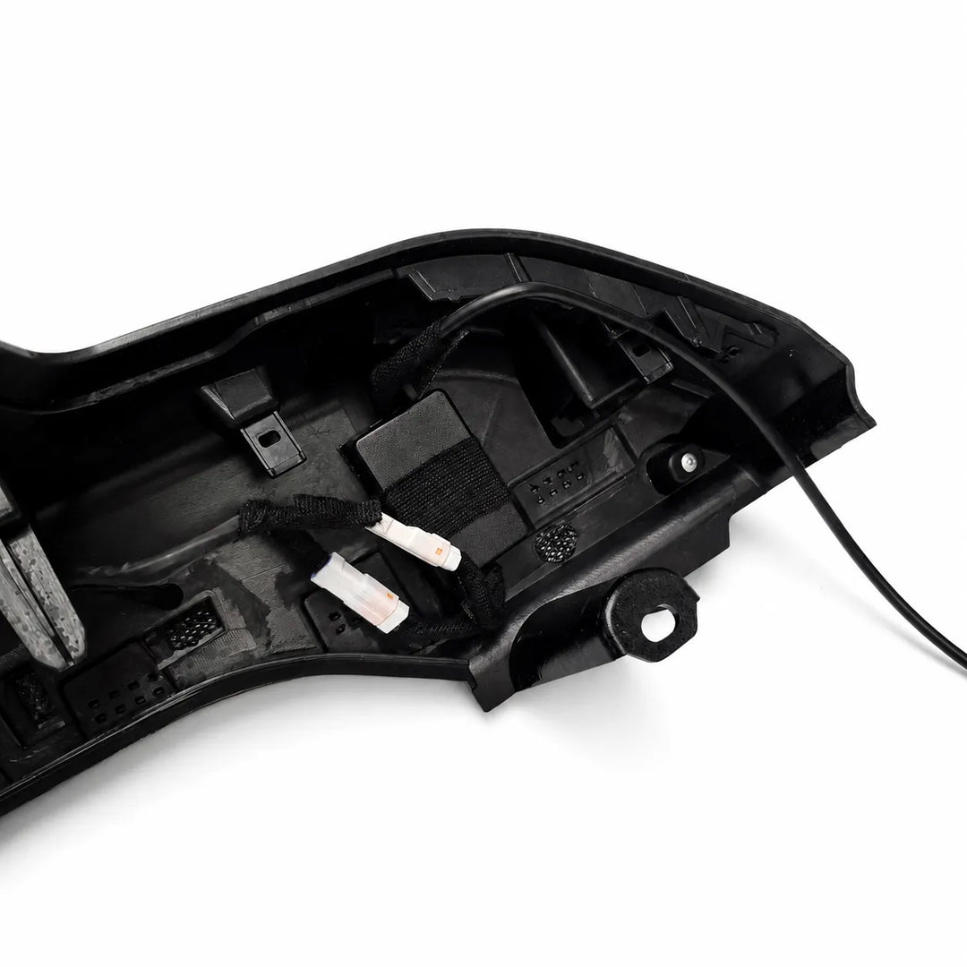 A close-up of a black plastic automotive led spoiler housing showing internal wiring, connectors, and mounting points on a white background.