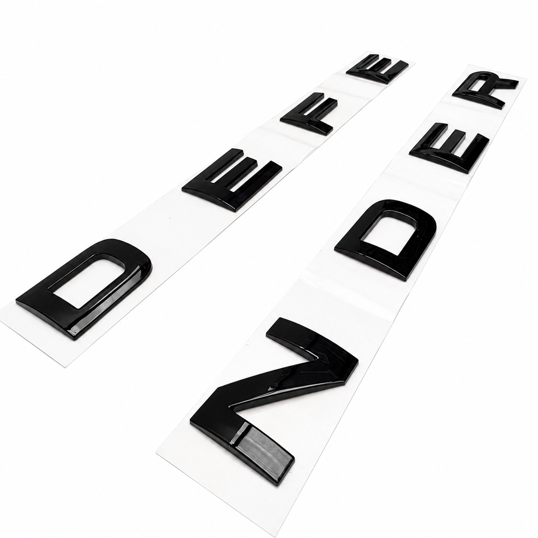 'Defender' bonnet lettering finished in black on a white background on an angle