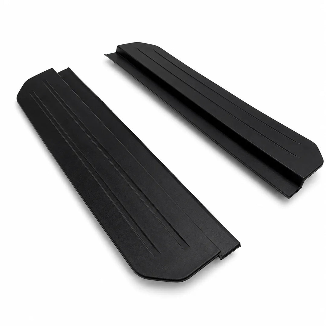 Two black protective side step foot panels with ribbed textures, shown on a plain white background. Compatible with L663 Defender