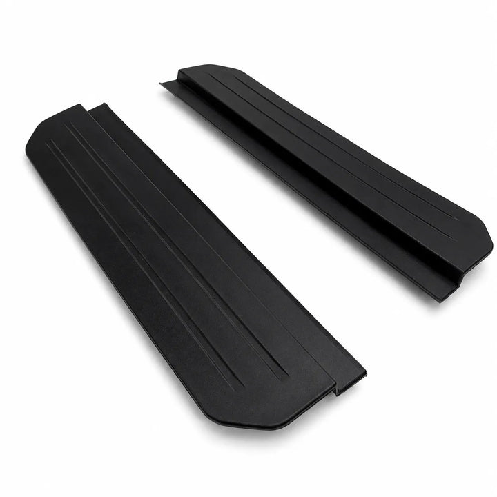 Two black protective side step foot panels with ribbed textures, shown on a plain white background. Compatible with L663 Defender