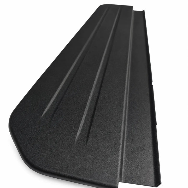 A black textured plastic panel or cover with three parallel raised ridges, shown at an angle on a plain white background.
