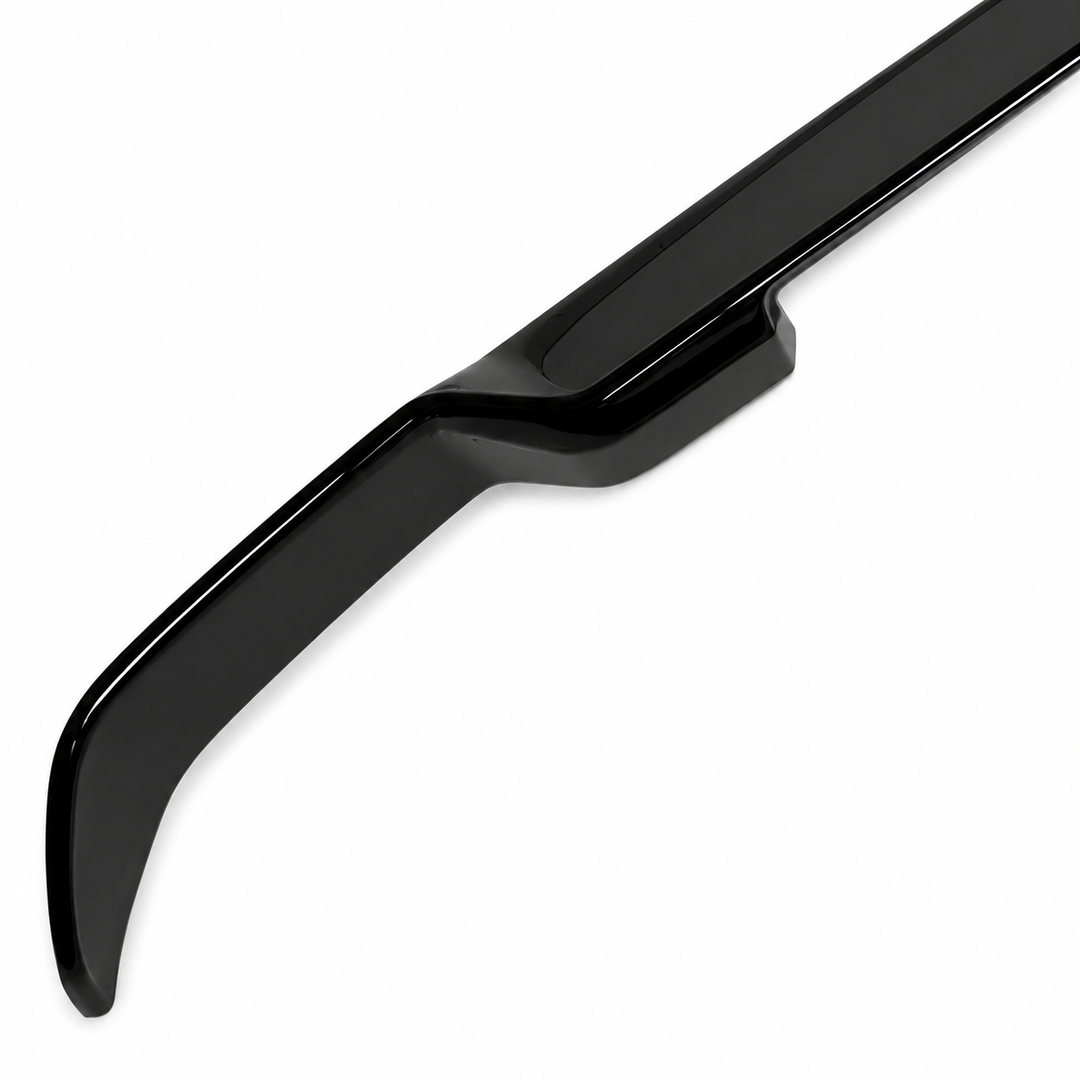 A glossy black automotive spoiler or lip trim piece shown diagonally on a plain white background.