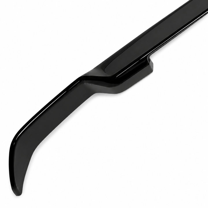 A glossy black automotive spoiler or lip trim piece shown diagonally on a plain white background.