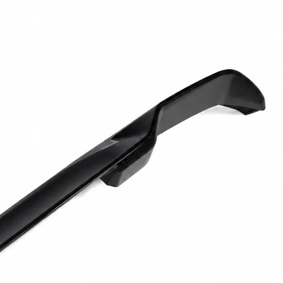 A glossy black automotive spoiler or lip trim piece shown at an angle on a plain white background.