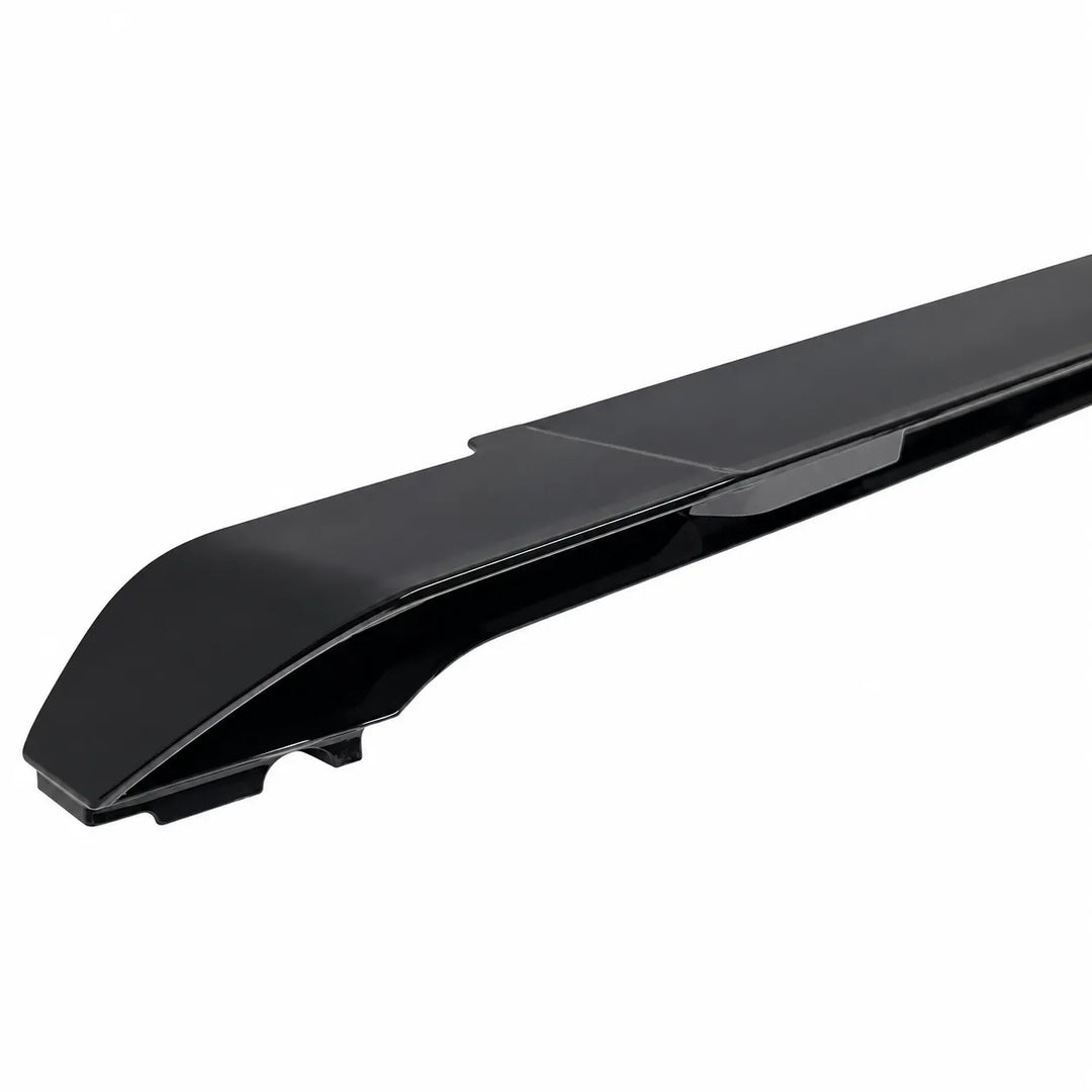 A glossy black automotive spoiler or lip trim piece shown at an angle on a plain white background.